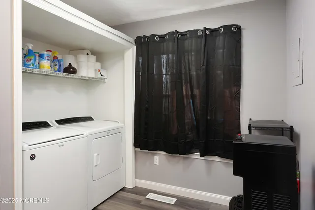a bathroom with a bathtub and a window
