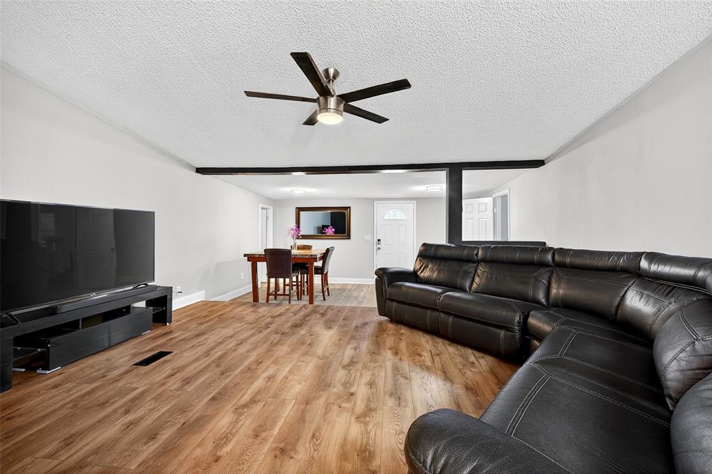 1918 East Foster Crossing Road Anna, TX 75409 - Photo 12 of 27 a living room with furniture and a flat screen tv