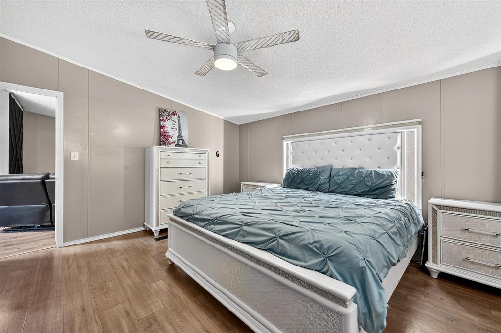 1918 East Foster Crossing Road Anna, TX 75409 - Photo 21 of 27 a bedroom with a bed and a dresser