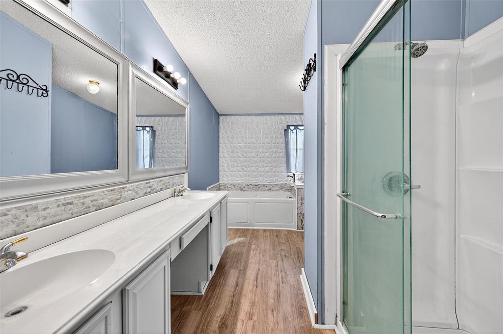 1918 East Foster Crossing Road Anna, TX 75409 - Photo 23 of 27 a bathroom with a tub sink shower and mirror