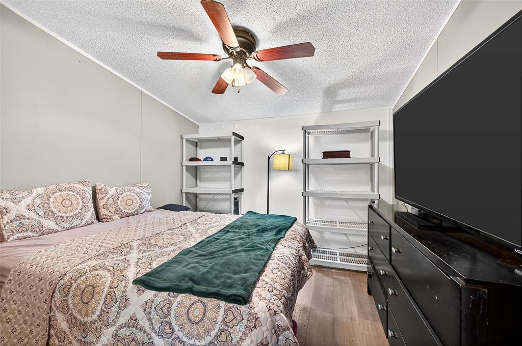 1918 East Foster Crossing Road Anna, TX 75409 - Photo 25 of 27 a bedroom with a bed and a walk in closet