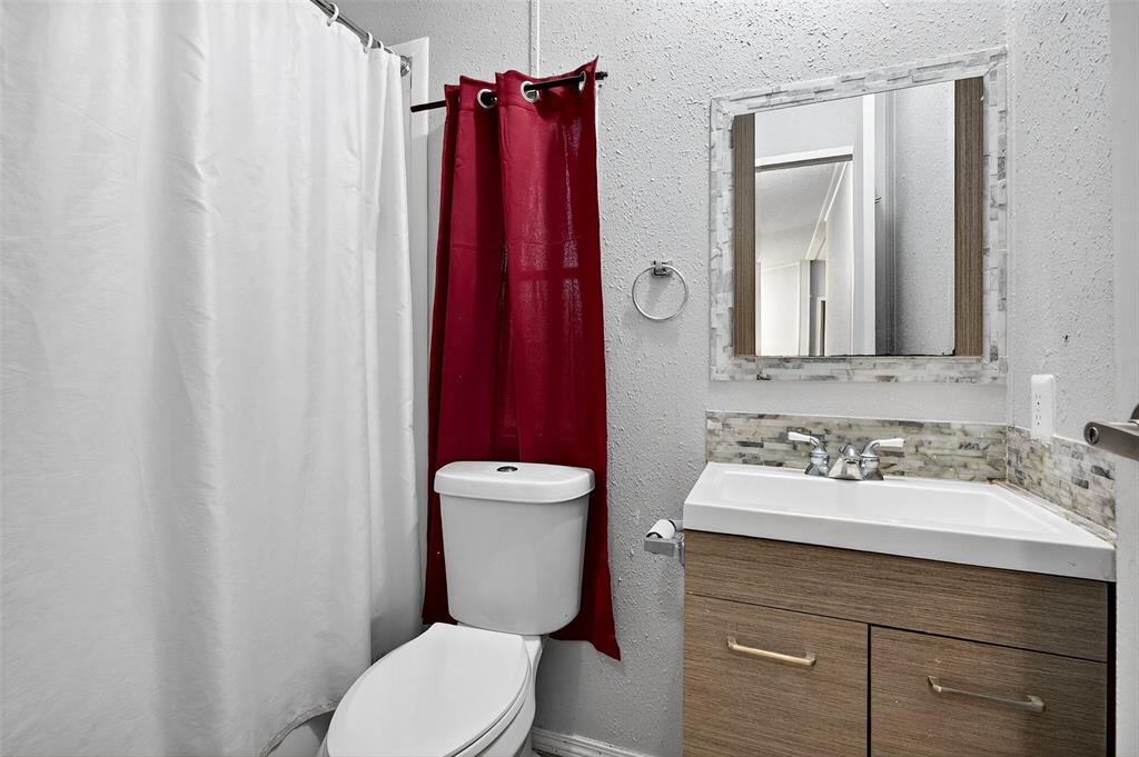 1918 East Foster Crossing Road Anna, TX 75409 - Photo 26 of 27 a bathroom with a sink vanity mirror and toilet