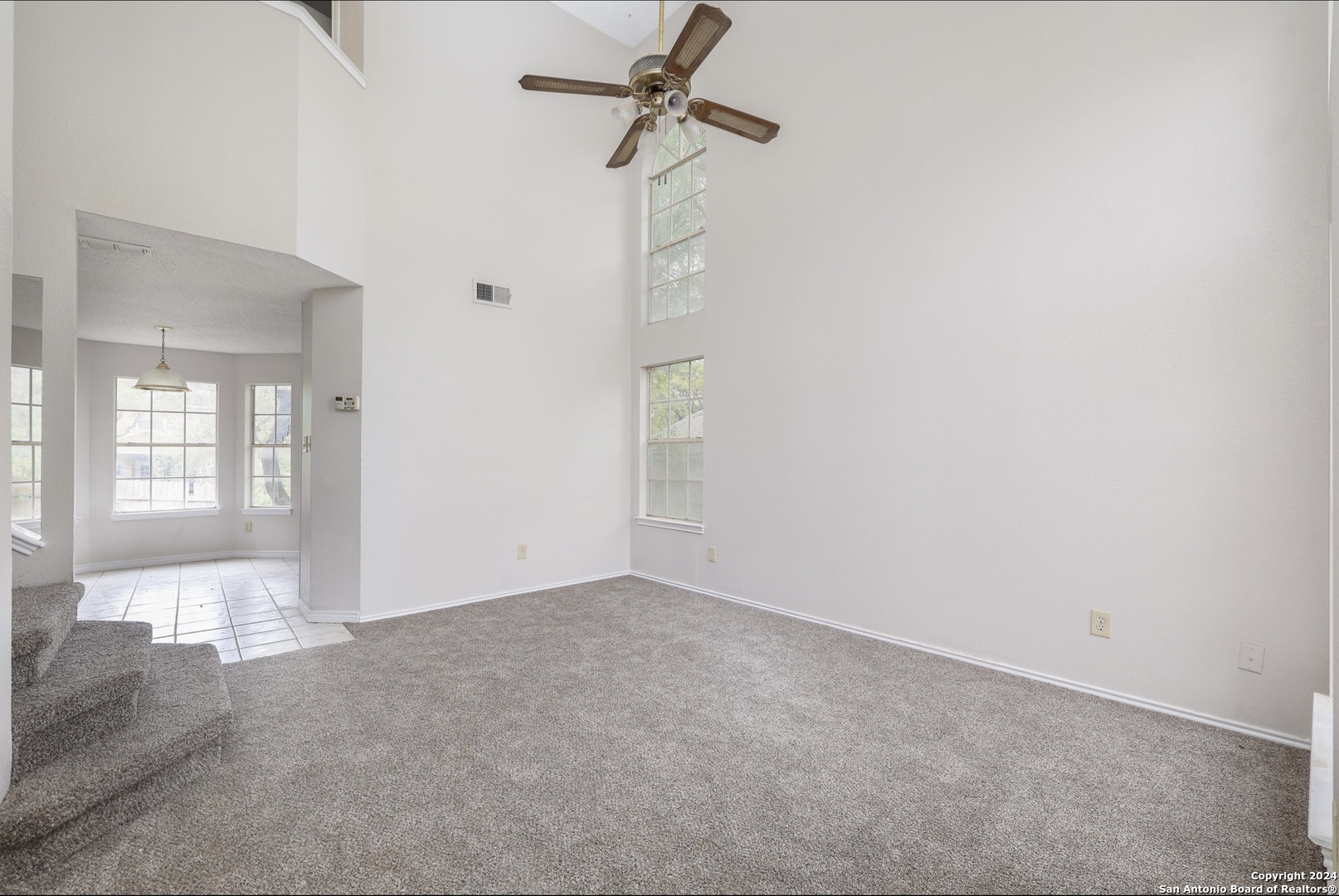 9159 Ridge Mill San Antonio, TX 78250 - Photo 4 of 17 a view of an empty room with a window