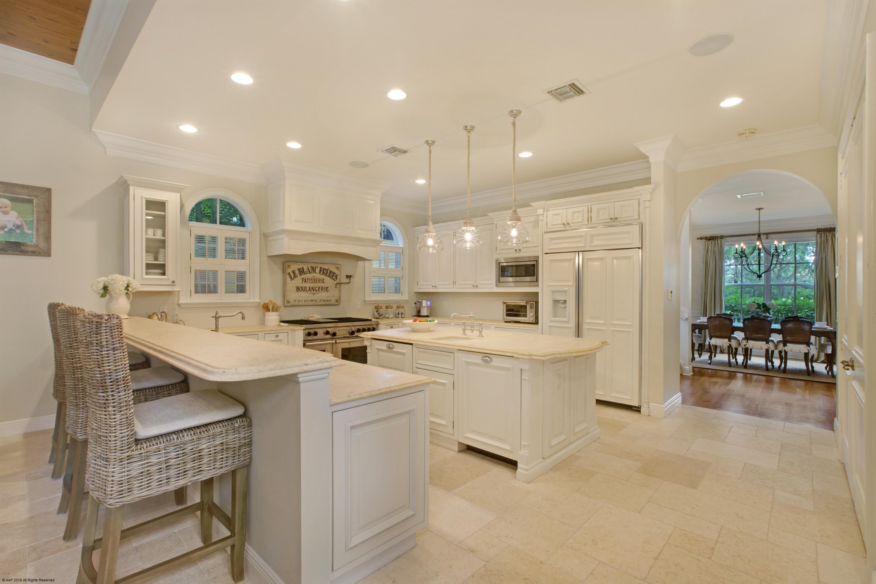 145 Segovia Way Jupiter, FL 33458 - Photo 9 of 43 KITCHEN WITH BAR