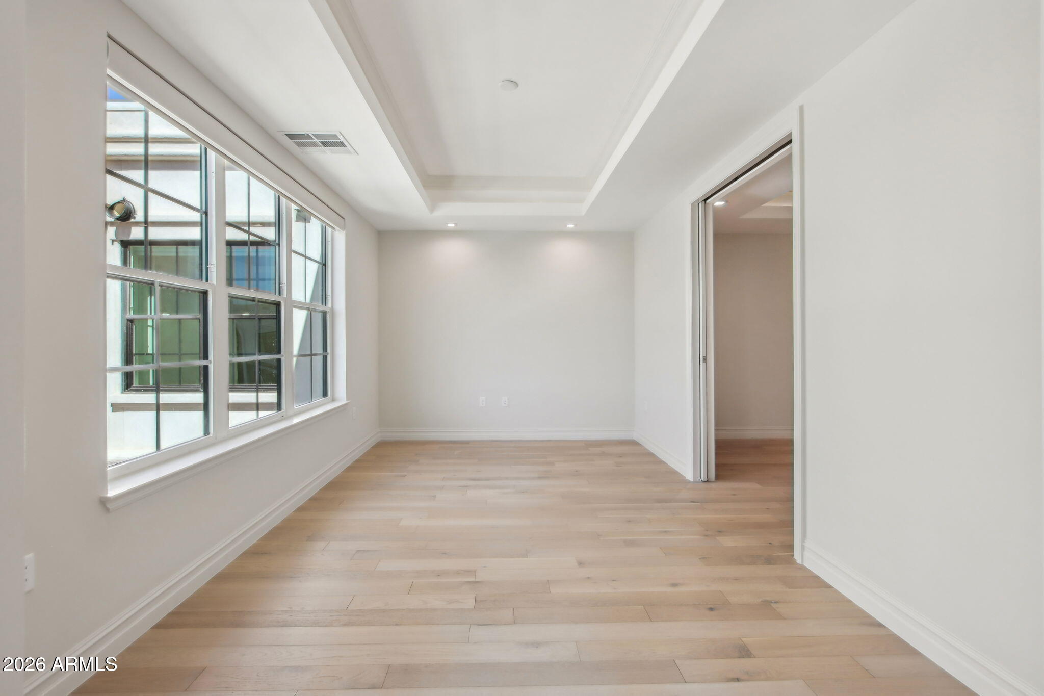 4240 East Camelback Road, Unit 514 Phoenix, AZ 85018 - Photo 6 of 16 a view of an empty room with a window