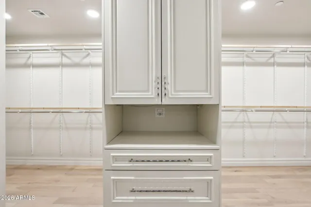 a bathroom with a sink a mirror and a shower