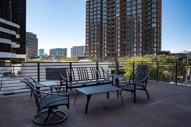 a view of a terrace with seating area and furniture