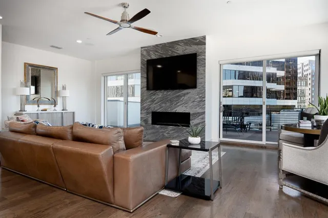 a living room with furniture and a fireplace