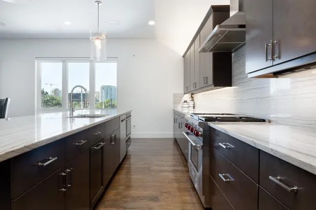 a kitchen with a stove and a sink