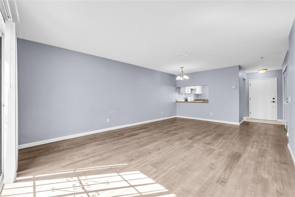 3738 Harrison Street, Unit 31 Riverside, CA 92503 - Photo 11 of 35 a view of empty room with wooden floor