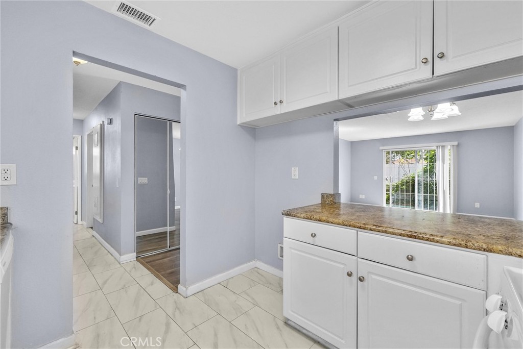 3738 Harrison Street, Unit 31 Riverside, CA 92503 - Photo 15 of 35 a kitchen with a sink and cabinets