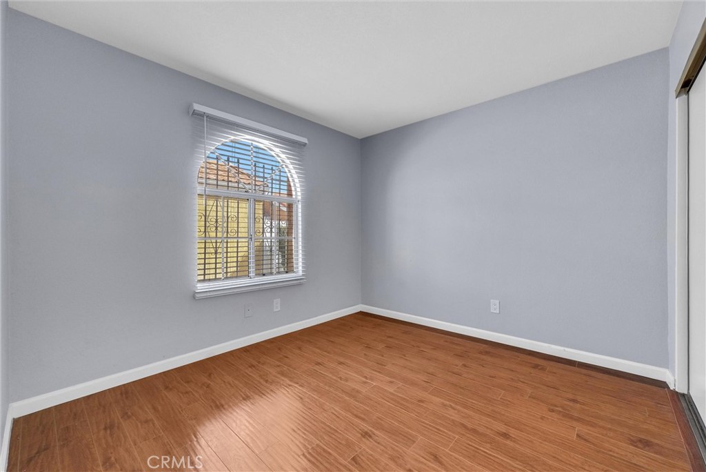 3738 Harrison Street, Unit 31 Riverside, CA 92503 - Photo 16 of 35 wooden floor in an empty room with a window