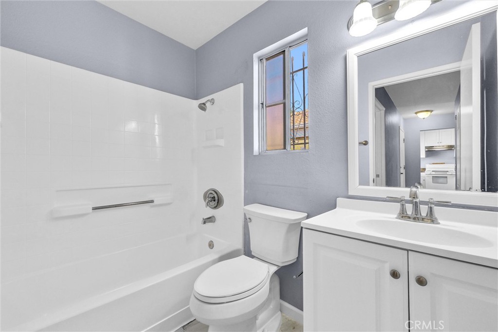 3738 Harrison Street, Unit 31 Riverside, CA 92503 - Photo 18 of 35 a bathroom with a sink toilet vanity and shower