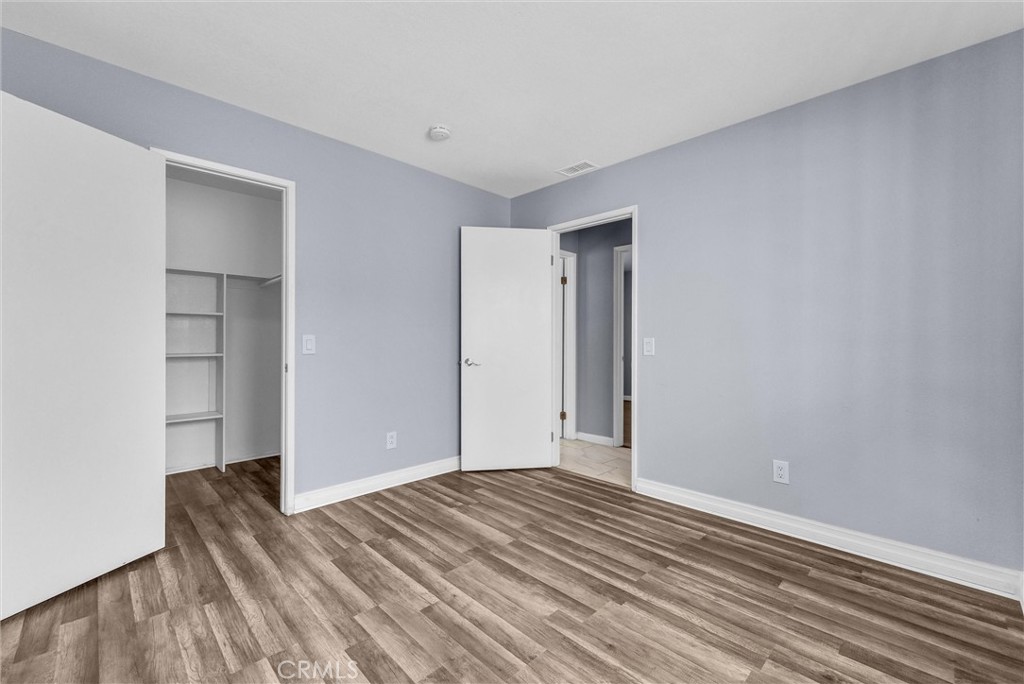 3738 Harrison Street, Unit 31 Riverside, CA 92503 - Photo 20 of 35 a view of empty room with wooden floor