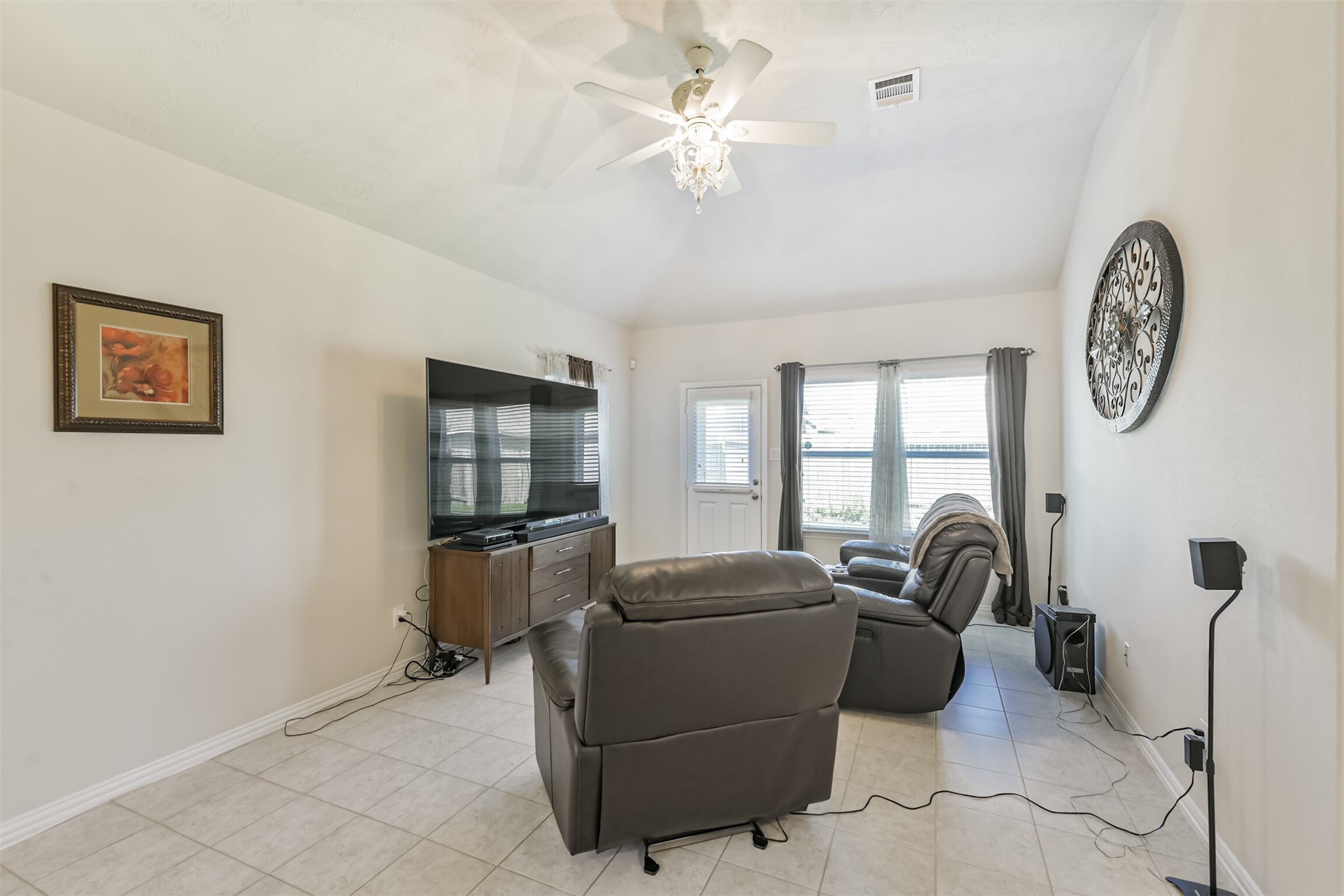 7527 Windsor Valley Lane Houston, TX 77049 - Photo 11 of 35 a living room with furniture a window and a ceiling fan