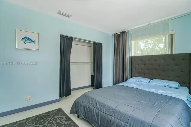 a bathroom with a sink toilet vanity and shower