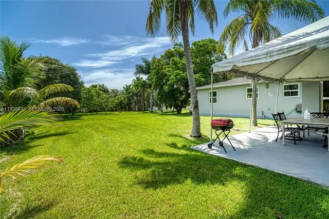 an aerial view of residential houses with city and ocean view