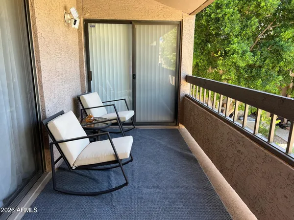 a view of a hallway with seating area
