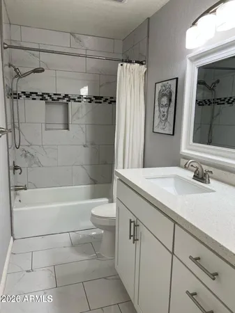 a bathroom with a sink a toilet and a bathtub