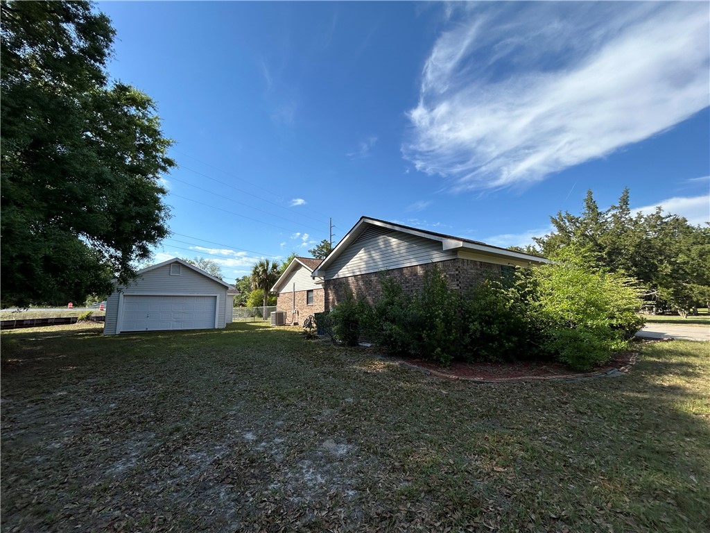 103 Cartwright Circle Brunswick, GA 31525 - Photo 2 of 5 Side of home and detached 2 car garage.