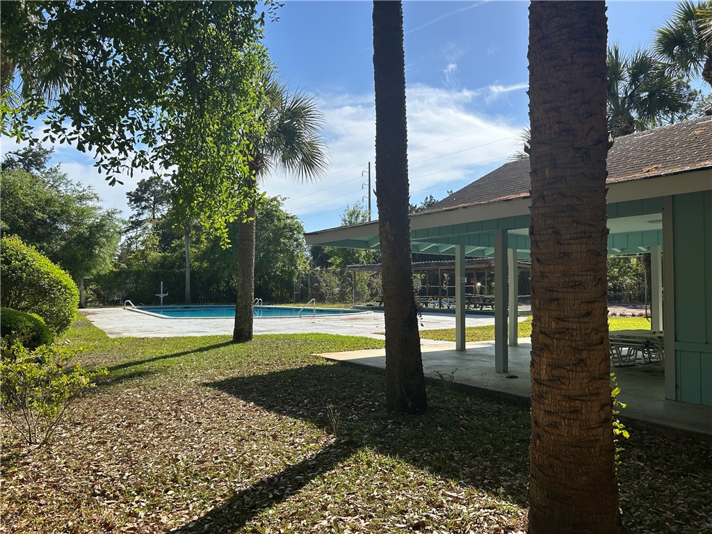103 Cartwright Circle Brunswick, GA 31525 - Photo 5 of 5 Community pool and tennis courts.
