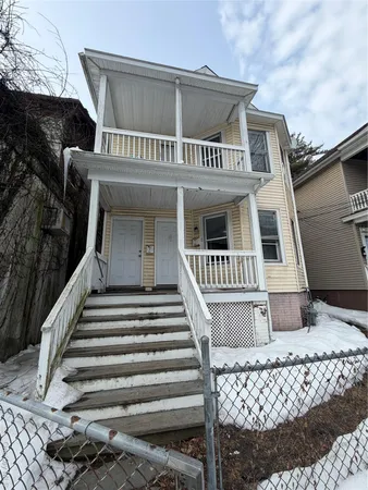 a front view of a house with stairs