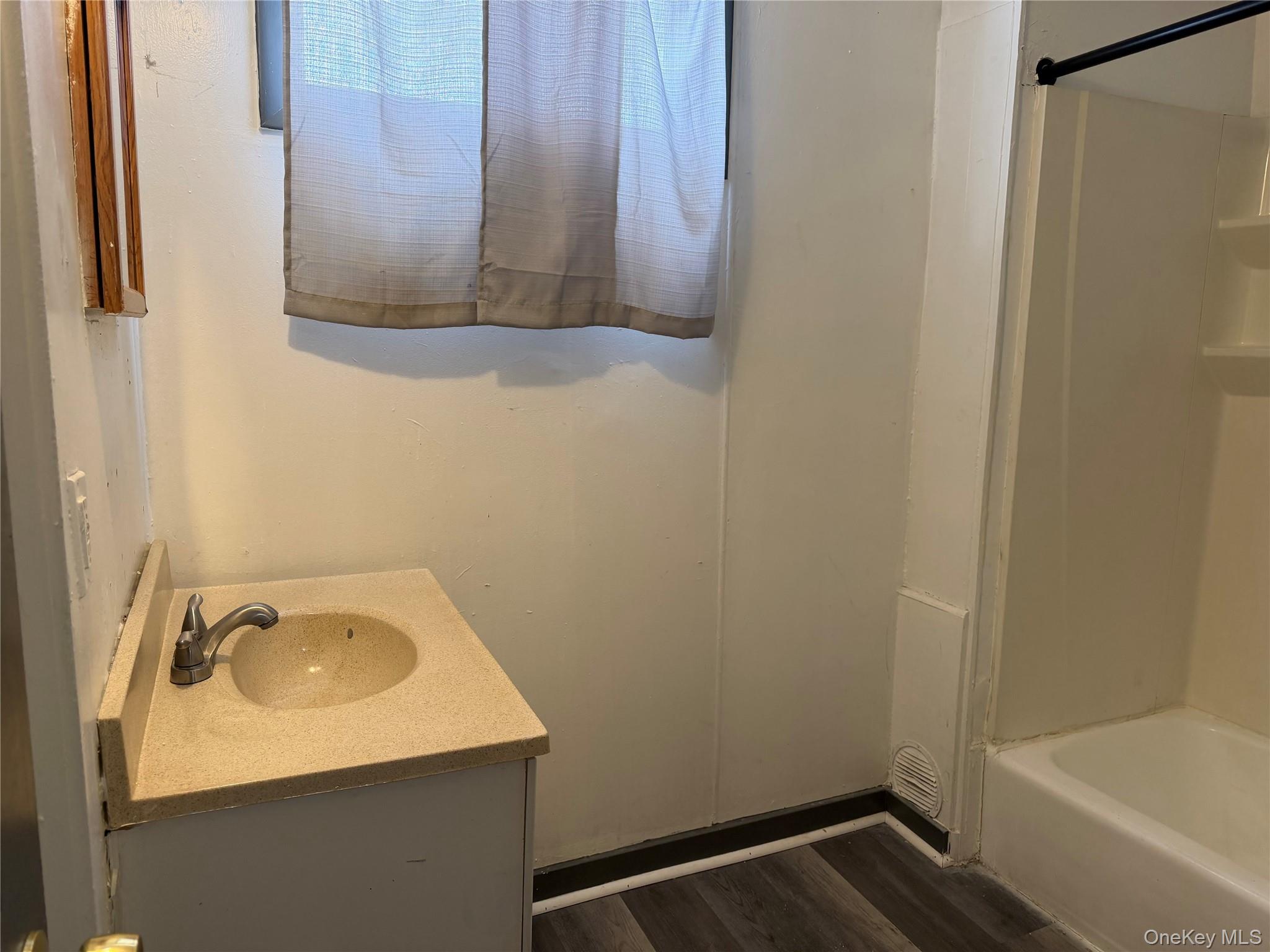 210 North Hamilton Street, Unit 1 Poughkeepsie, NY 12601 - Photo 11 of 15 a bathroom with a sink and a bathtub