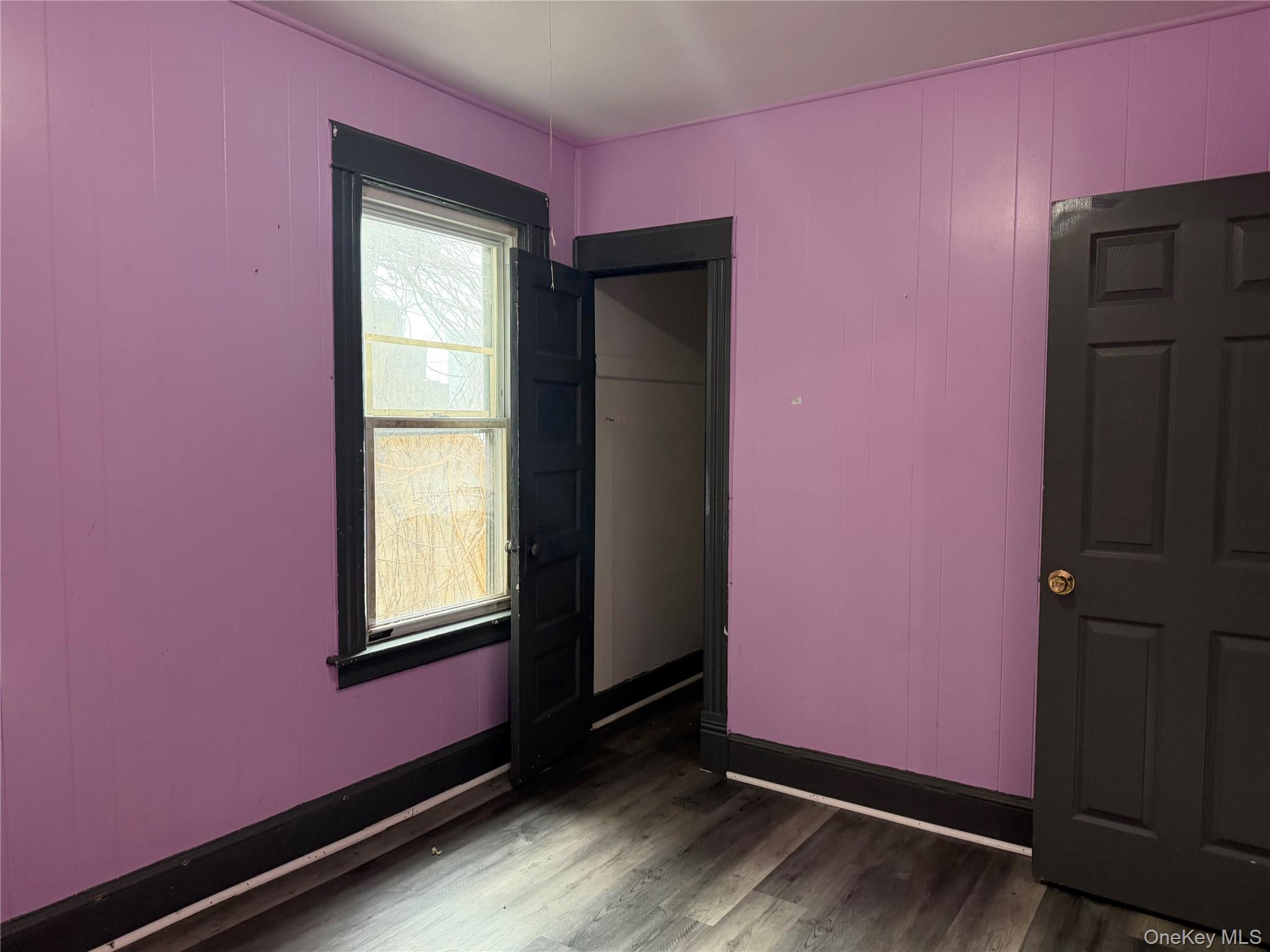 210 North Hamilton Street, Unit 1 Poughkeepsie, NY 12601 - Photo 12 of 15 a view of empty room with wooden floor and fan