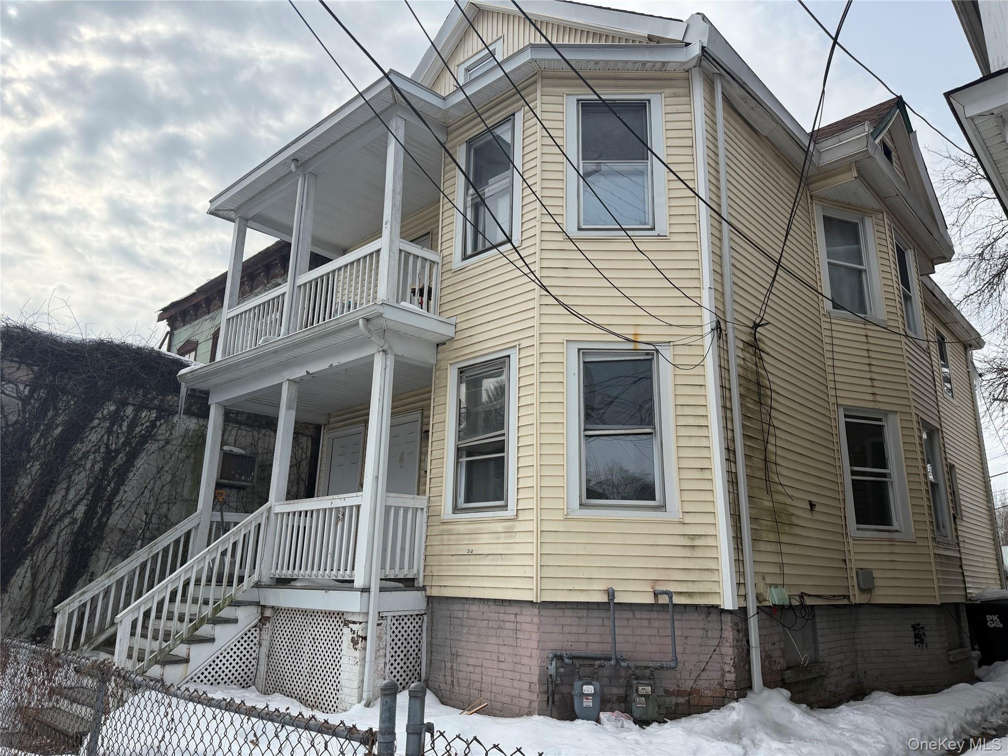 210 North Hamilton Street, Unit 1 Poughkeepsie, NY 12601 - Photo 2 of 15 a view of a house with iron fence
