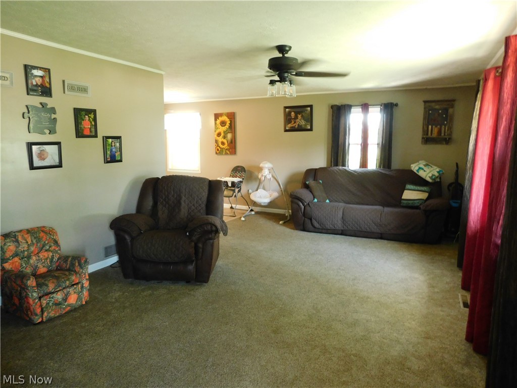 31 Pine Run Road Washington, WV 26181 - Photo 4 of 25 Different view of living room which leads to the dining area on the left.