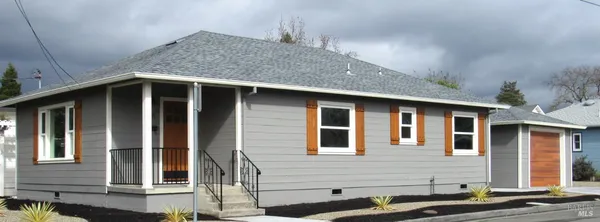 a front view of a house with garage