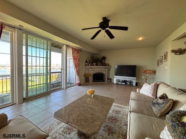 335 Gull Cove Brigantine, NJ 08203 - Photo 18 of 30 a living room with furniture a flat screen tv and a fireplace