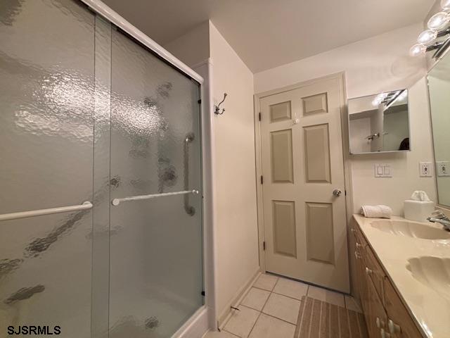 335 Gull Cove Brigantine, NJ 08203 - Photo 6 of 30 a bathroom with a double vanity sink mirror and shower