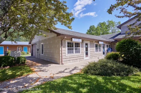 a view of an empty room with lots of furniture