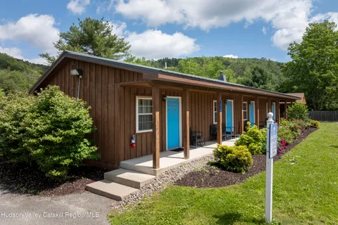 a bedroom with a large bed and a large window