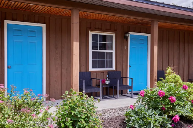 a bedroom with a bed and a desk