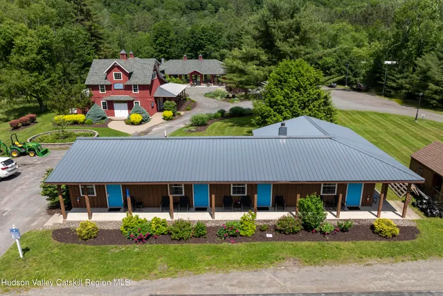 a kitchen with stainless steel appliances kitchen island granite countertop a sink and cabinets