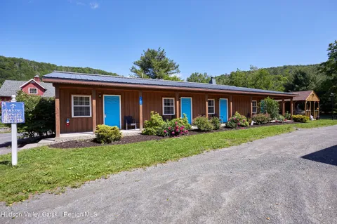 a kitchen with stainless steel appliances granite countertop a sink and a stove