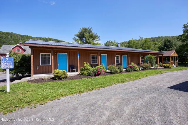 a kitchen with stainless steel appliances granite countertop a sink and a stove