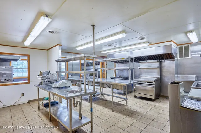 a kitchen with stainless steel appliances granite countertop a sink and cabinets