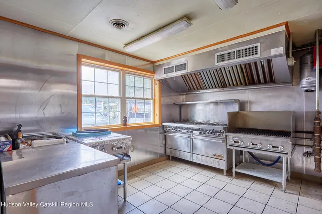 a view of a chairs and table in the balcony