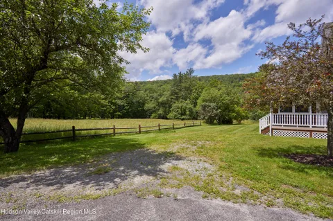 a view of a dining area with furniture and wooden floor