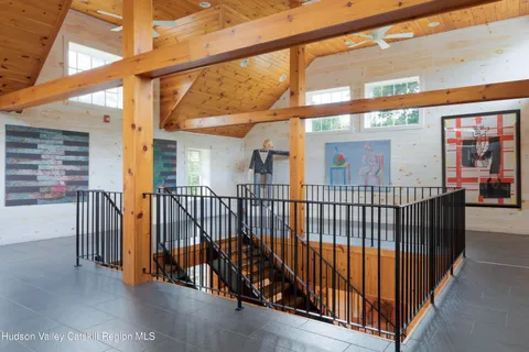 a view of swimming pool with a lawn chairs and a yard