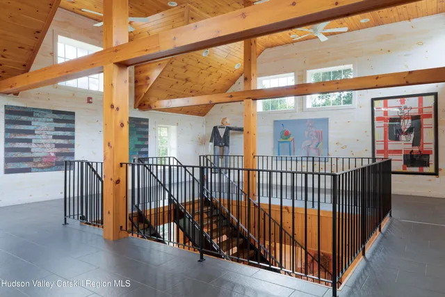 a view of swimming pool with a lawn chairs and a yard