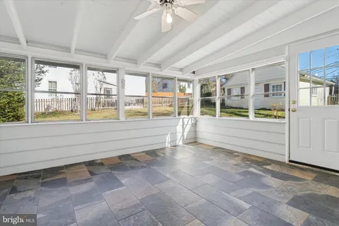 a view of an entryway with wooden floor