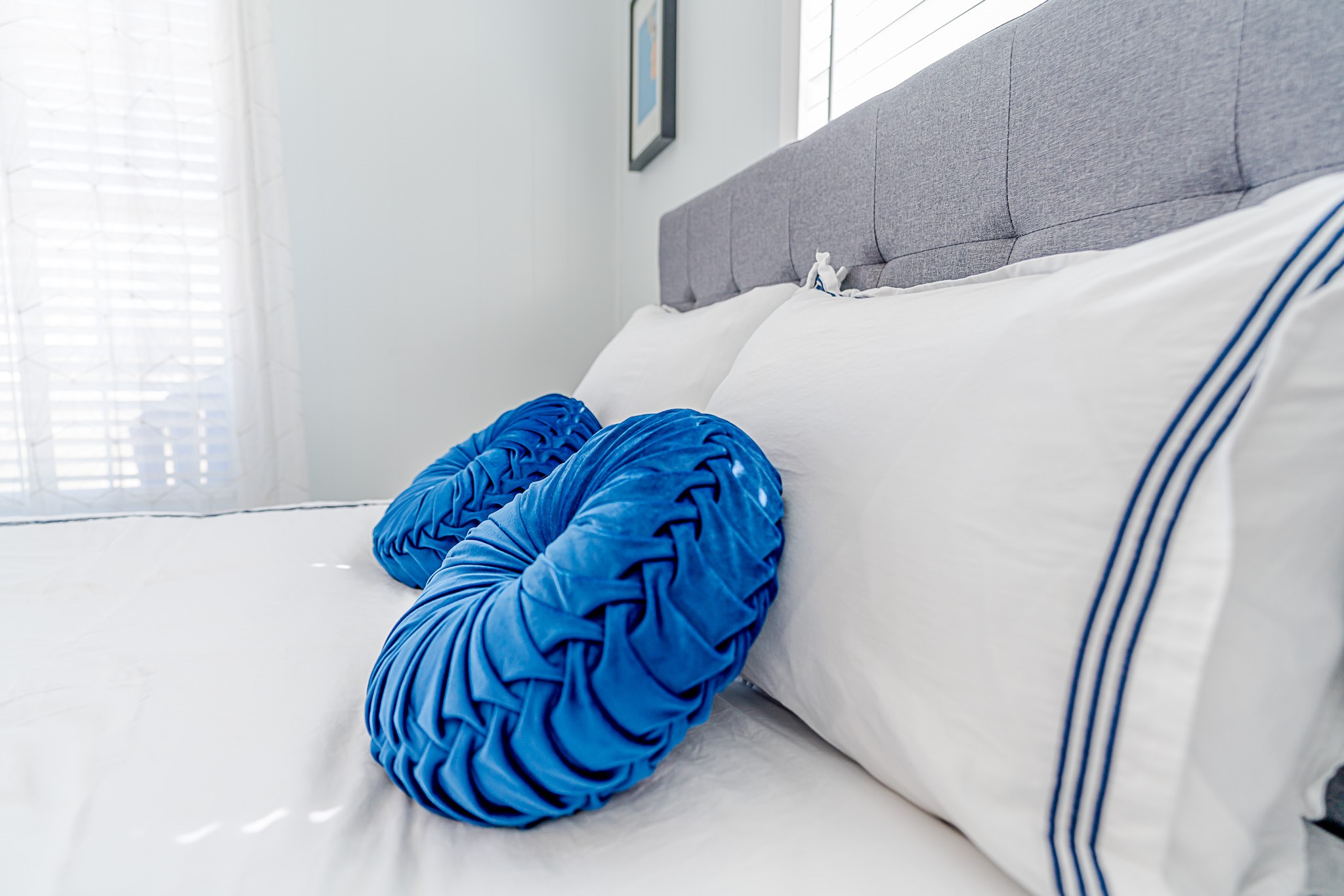 402 Seashell Drive Surfside Beach, TX 77541 - Photo 16 of 35 a bed sitting in a bedroom next to a window