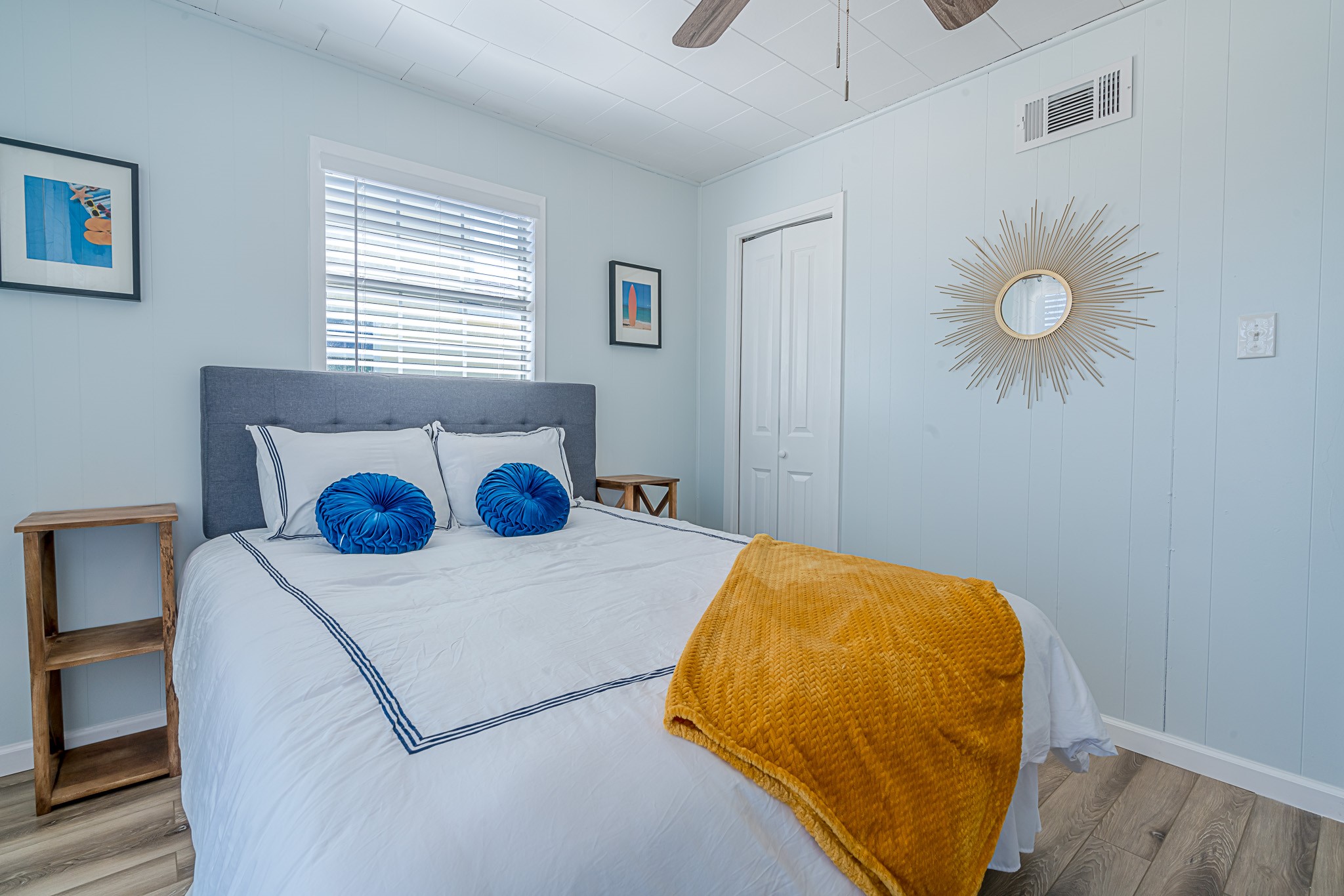 402 Seashell Drive Surfside Beach, TX 77541 - Photo 17 of 35 a bedroom with a bed and a chandelier