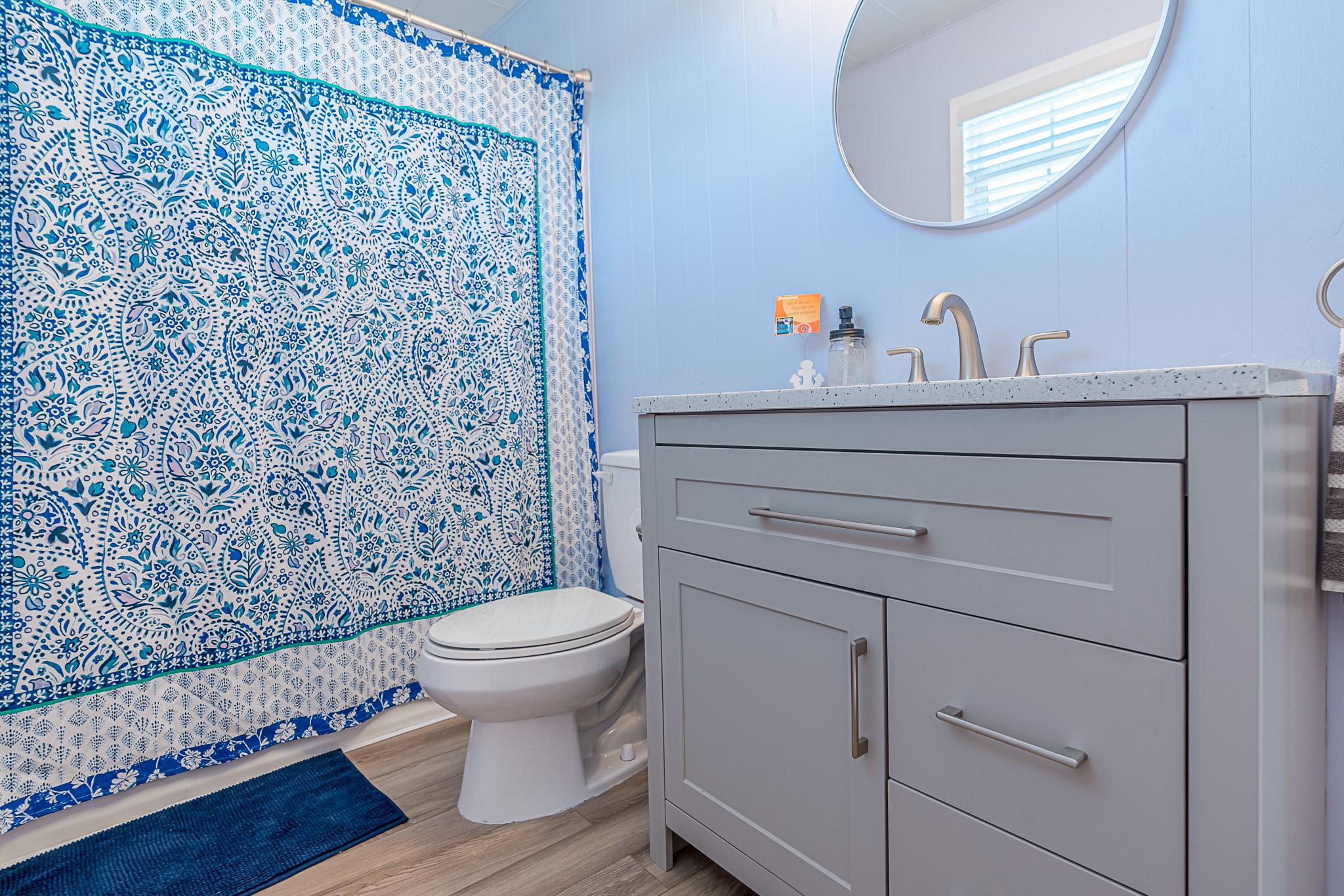 402 Seashell Drive Surfside Beach, TX 77541 - Photo 23 of 35 a bathroom with a toilet and a mirror