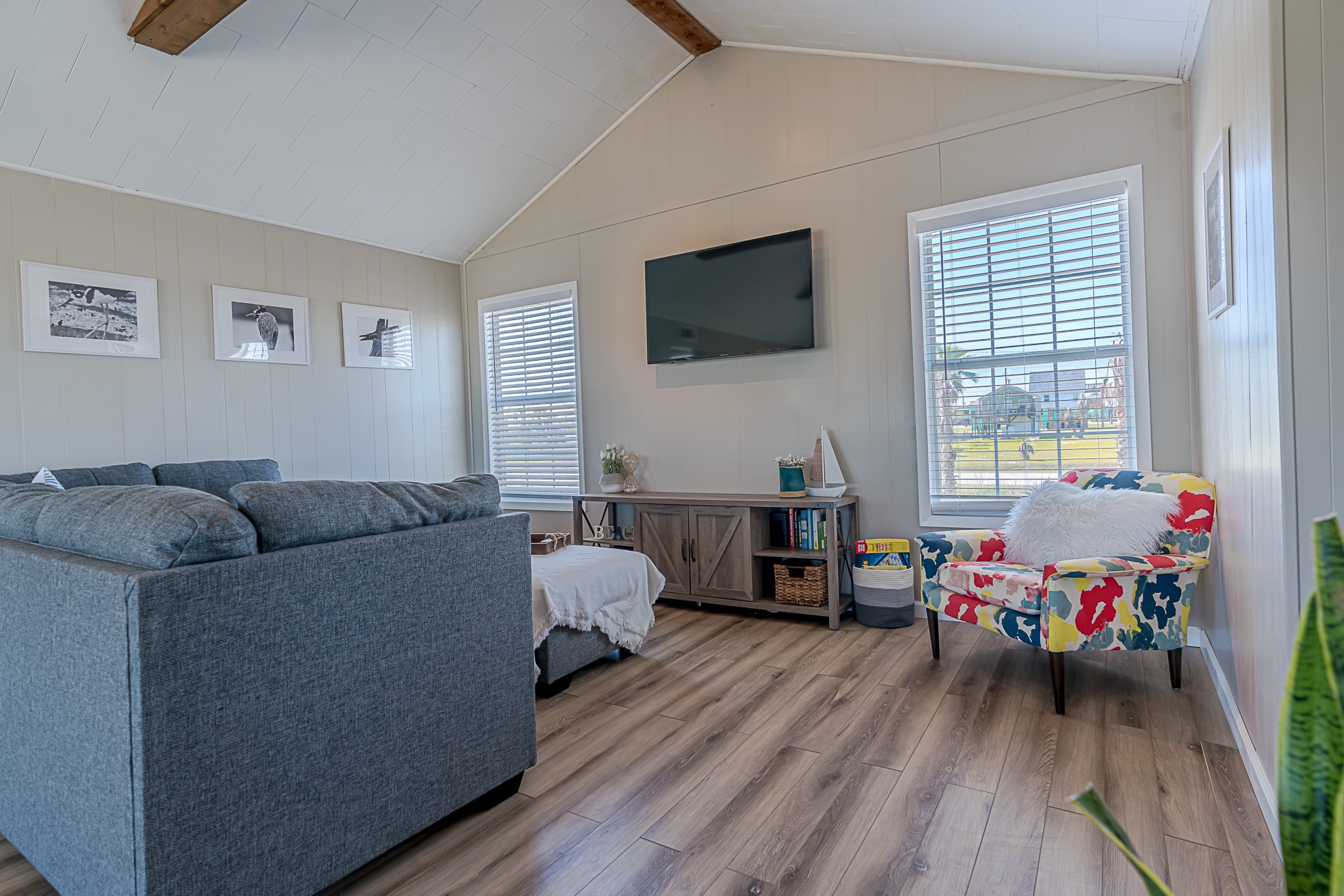 402 Seashell Drive Surfside Beach, TX 77541 - Photo 8 of 35 a living room with furniture and a flat screen tv