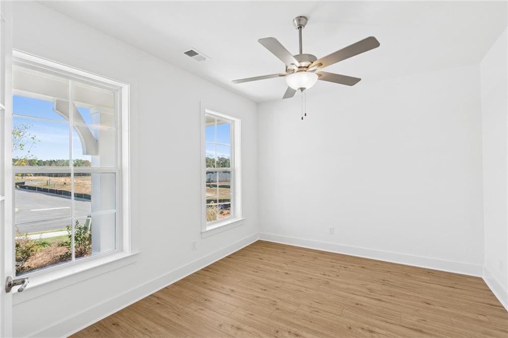 580 Barnfield Way Hiram, GA 30141 - Photo 6 of 12 a view of a room with wooden floor and windows